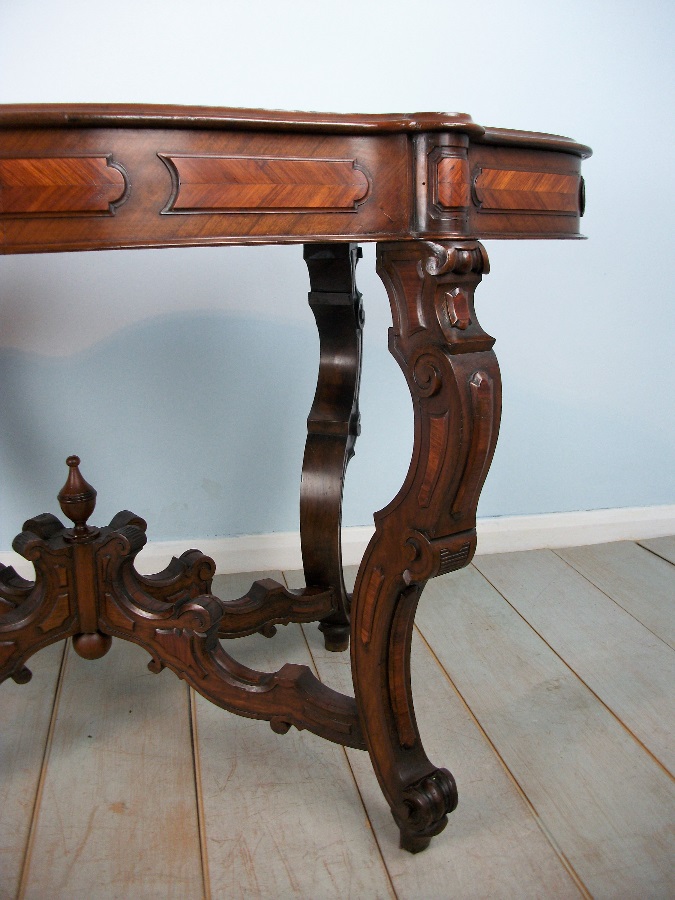 Antique Italian Occasional Table with profusely carved and shaped legs 